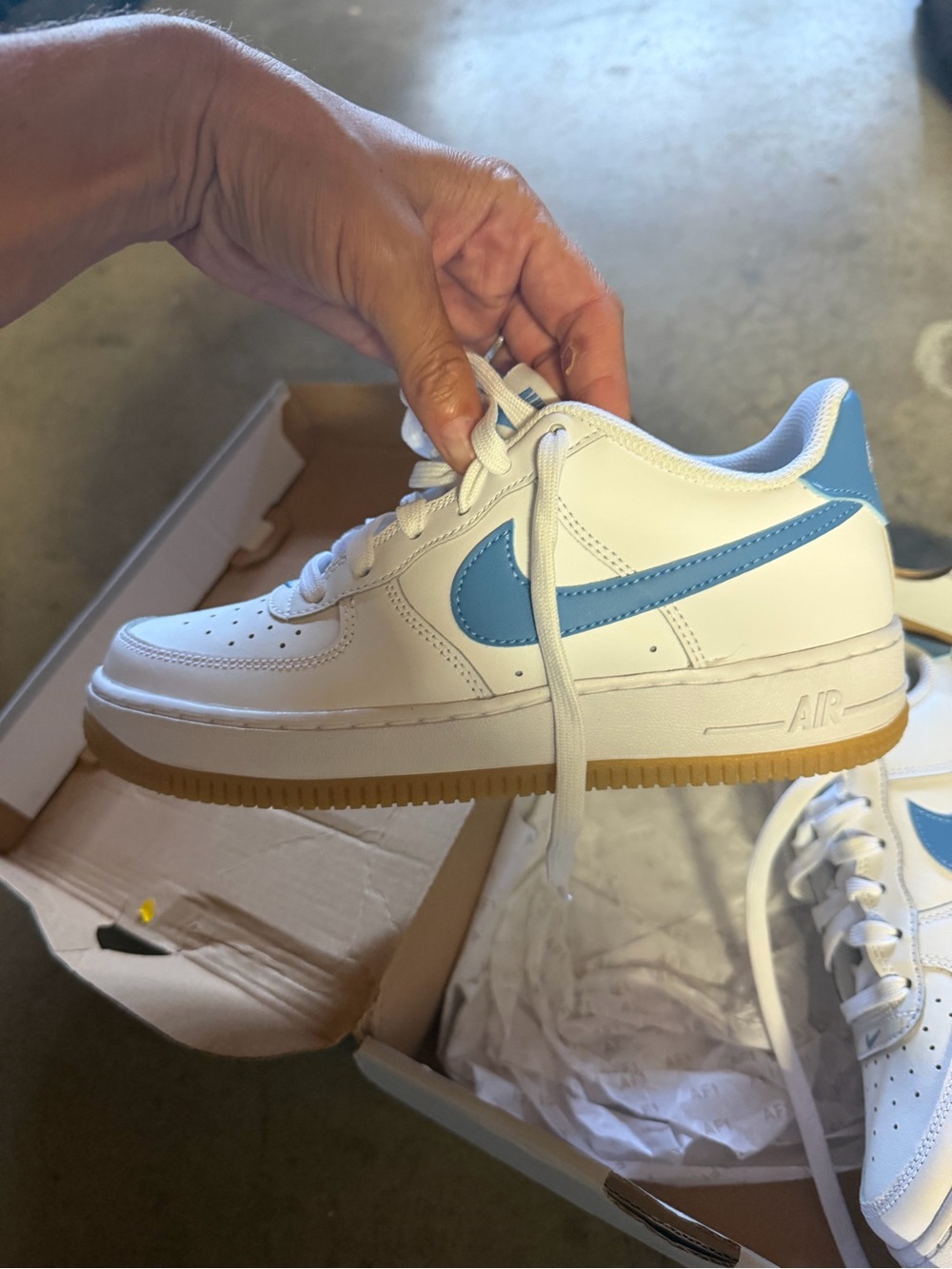 Nike Kids White Sneakers with Light Blue Swoosh and Gum Outsole